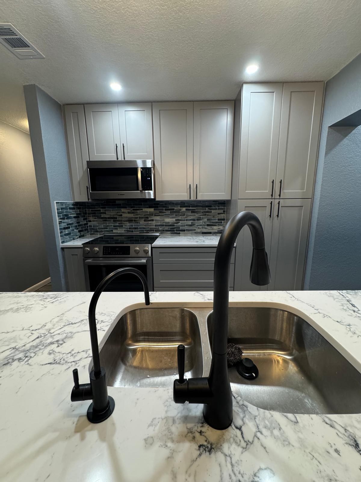 Kitchen sink and faucet detail after remodel