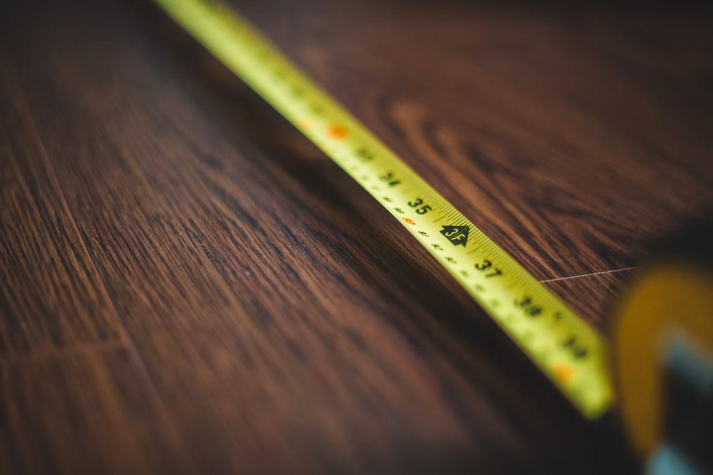Tape measure on wood surface