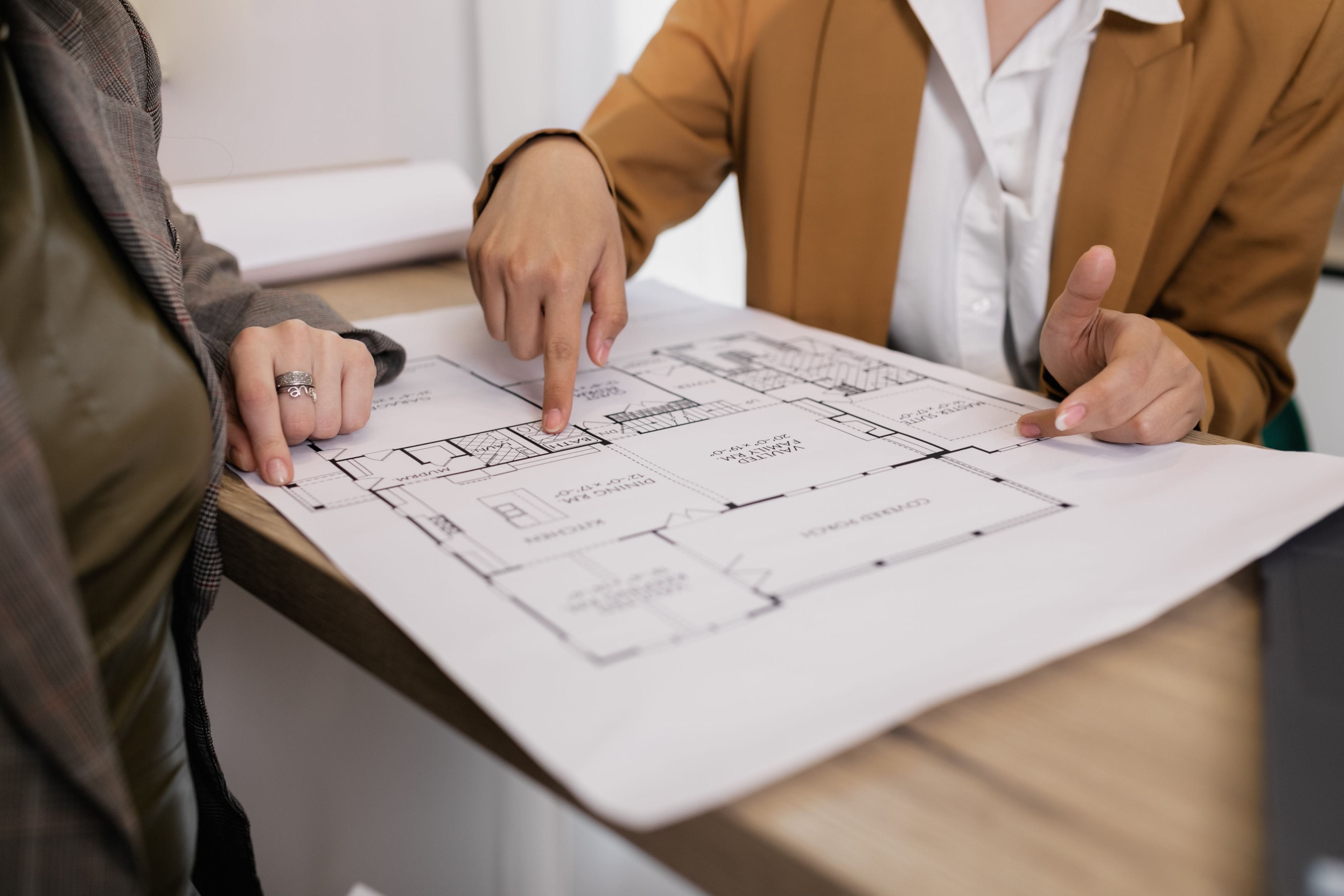 Project plans being reviewed at a table